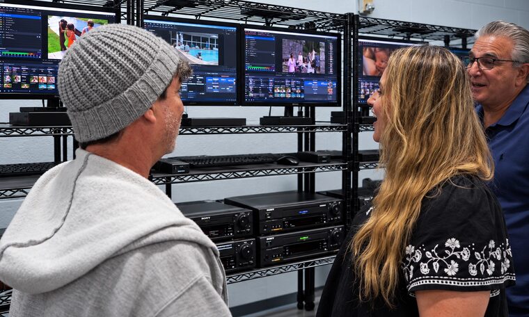 Customers watching their home movies play back on the studio monitors