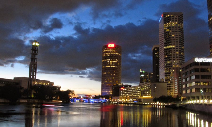 The Tampa skyline at dusk seen across the Hillsborough River from the Tampa Riverwalk