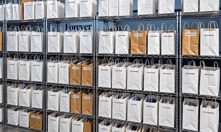 Shelves of labelled customer bags in the Forever Studios intake room