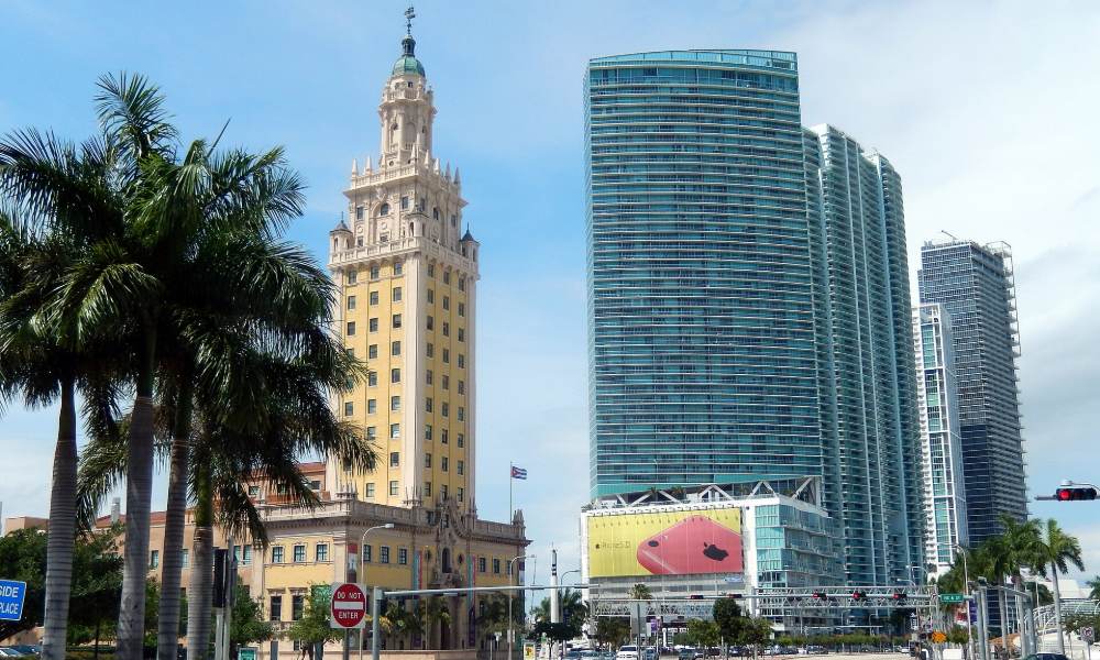 The Freedom Tower on Biscayne Boulevard in downtown Miami, seen between palm trees