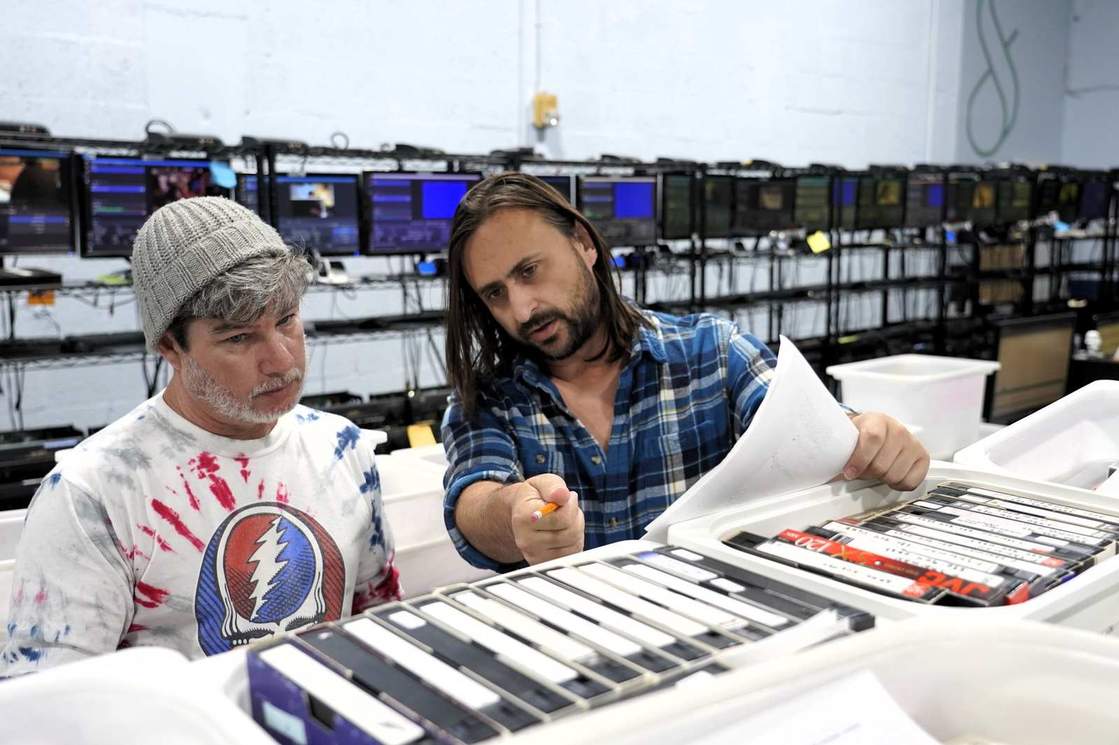 Two Forever Studios engineers going through a customer’s tapes at the bench in Boca Raton