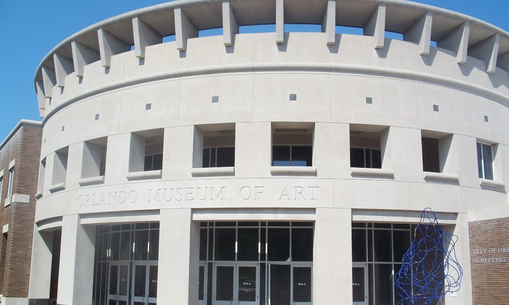 The curved facade of the Orlando Museum of Art with its name carved into the stone