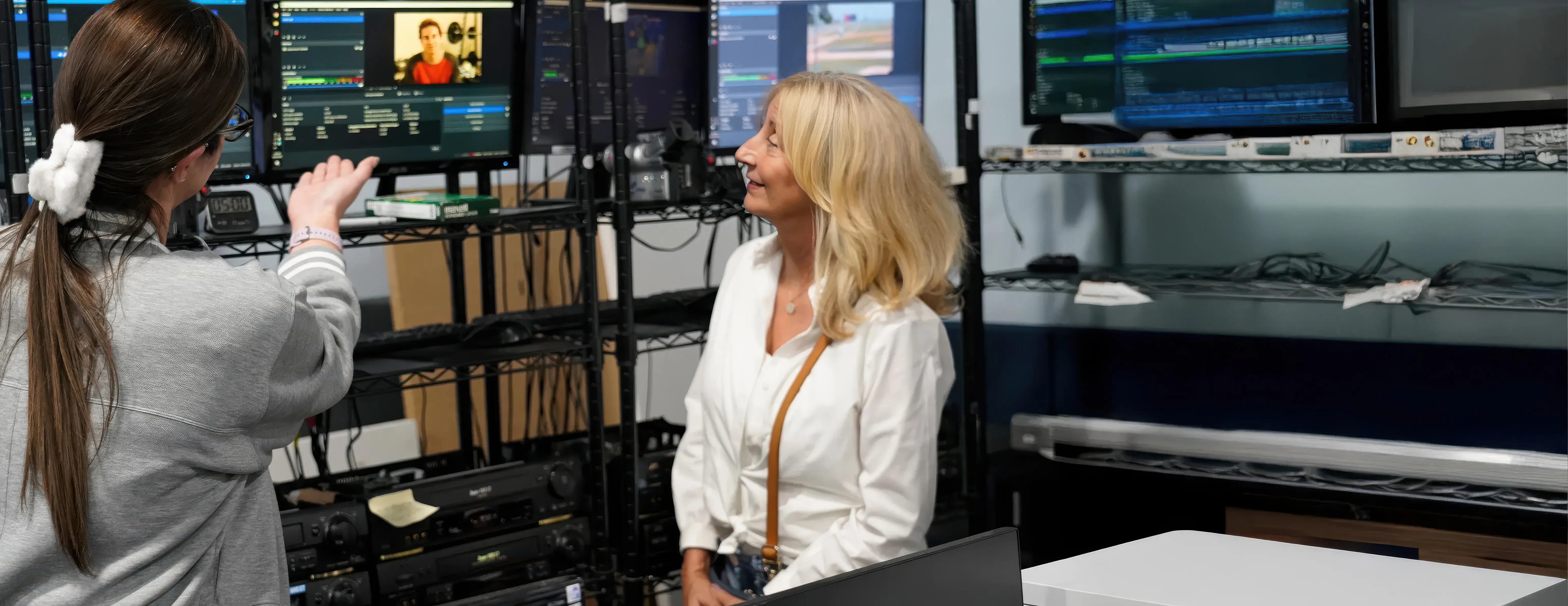 A Forever Studios technician at a capture station with footage on the monitors