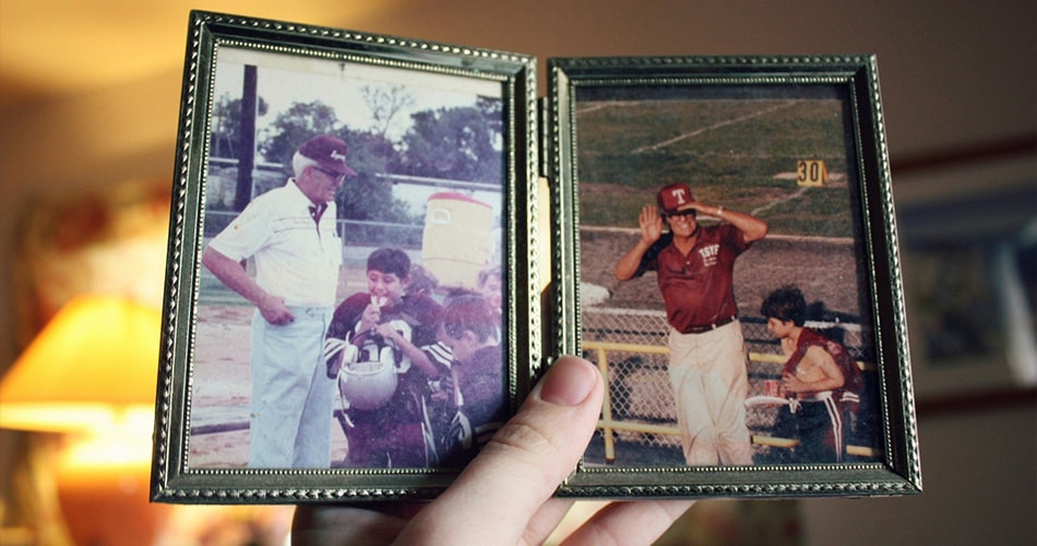 Gallery wall of framed family photos with UV-filtering glass and acid-free matting