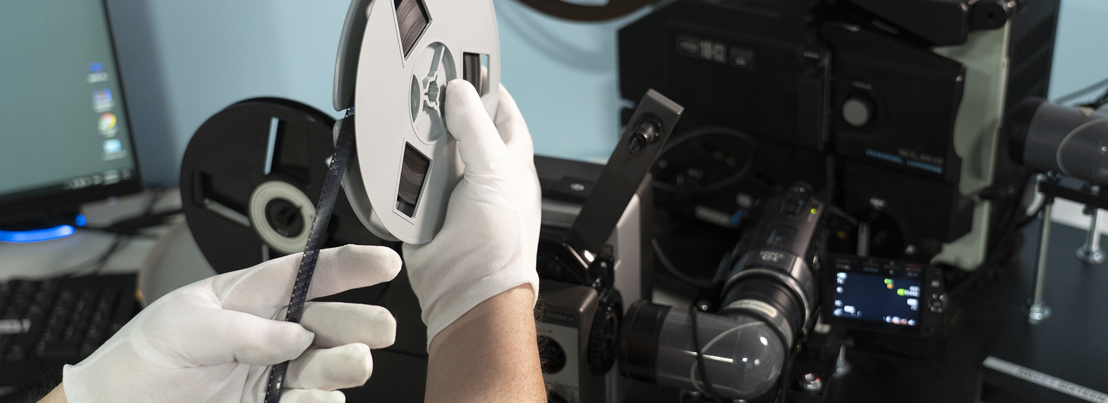 Forever Studios Film Technician Inspecting Film Reel